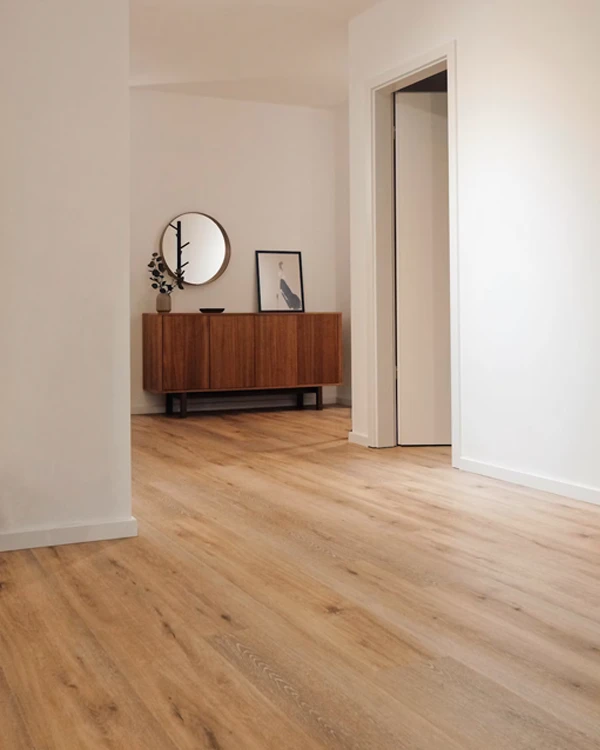 Light coloured wooden flooring being installed in Tauranga home. Natural lighting makes the room look open and spacious
